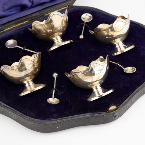 397 - A SET OF FOUR EDWARDIAN SILVER SALTS by Charles Edwards, London 1906, each circular with an undulati... 