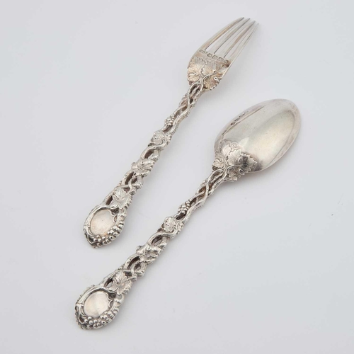 432 - A VICTORIAN SILVER 'VINE' PATTERN FORK AND SPOON by George William Adams, London 1860 and 1862, each... 