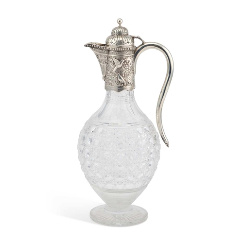 454 - A VICTORIAN SILVER-MOUNTED CUT-GLASS CLARET JUG by Charles Boyton (II), London 1884, the mount chase... 