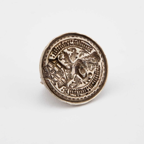 527 - AN UNUSUAL SILVER SEAL the circular matrix with a hinged demilune handle to the reverse, unmarked. 3... 