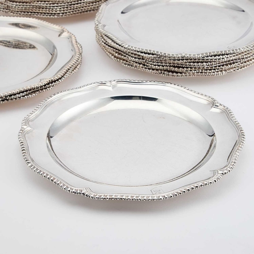 528 - A SET OF TWENTY-FOUR GEORGE III SILVER DINNER PLATES probably by John King, London 1764, cusped circ... 