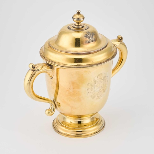 540 - A GEORGE I SILVER-GILT CUP AND COVER maker C(?)O, London 1715, the domed cover with a turned finial ... 