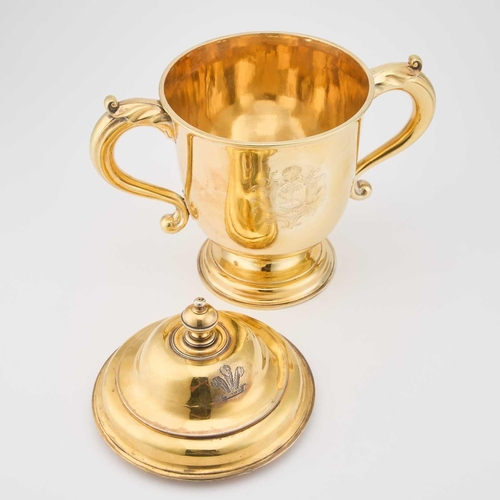 540 - A GEORGE I SILVER-GILT CUP AND COVER maker C(?)O, London 1715, the domed cover with a turned finial ... 