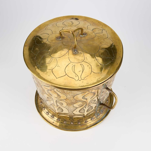 545 - AN ARTS AND CRAFTS BRASS COAL BIN the domed lid with a tri-form handle, the base with slightly taper... 