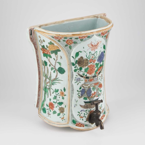 599 - A FAMILLE VERTE WALL-MOUNTED CISTERN the waisted body with moulded panels, enamel painted with a vas... 