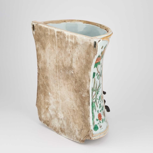 599 - A FAMILLE VERTE WALL-MOUNTED CISTERN the waisted body with moulded panels, enamel painted with a vas... 