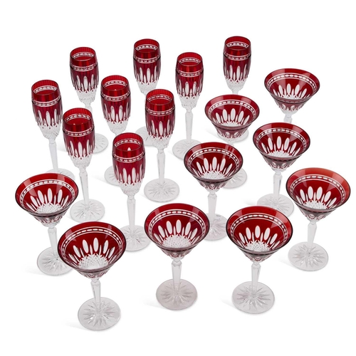 60 - A SUITE OF RUBY AND CLEAR GLASS FLUTES AND WINE GLASSES 20th Century, comprising nine flutes and nin... 