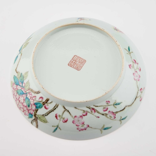 605 - A CHINESE FAMILLE ROSE DISH circular with rounded sides, enamel painted with butterflies and flowers... 