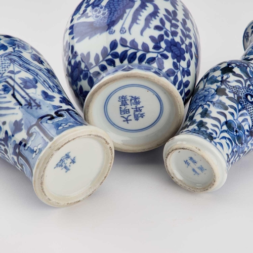 613 - A GROUP OF CHINESE BLUE AND WHITE PORCELAIN comprising three vases and three planters. (6) Tallest 2... 