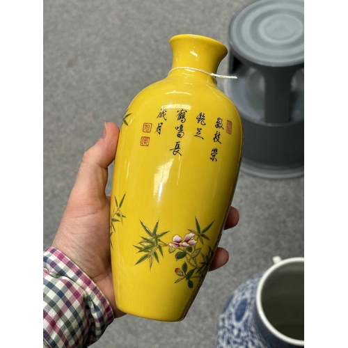 624 - A CHINESE FAMILLE ROSE GINGER JAR painted with flowers and rockwork; together with a Chinese yellow ... 