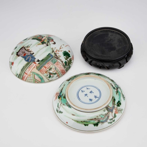 631 - A CHINESE FAMILLE VERTE BOX AND COVER circular, painted with figures, bears a six-character mark in ... 