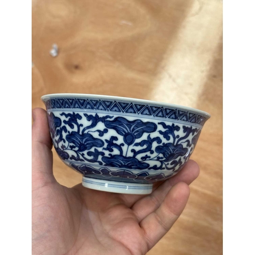 644 - A CHINESE BLUE AND WHITE BOWL underglaze blue painted with flowers and tendrils, the interior furthe... 