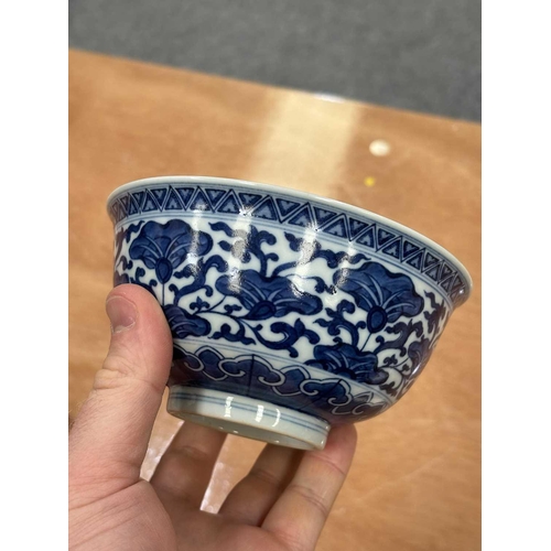 644 - A CHINESE BLUE AND WHITE BOWL underglaze blue painted with flowers and tendrils, the interior furthe... 