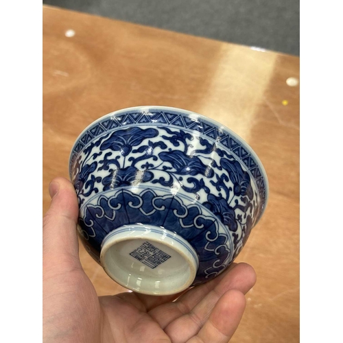 644 - A CHINESE BLUE AND WHITE BOWL underglaze blue painted with flowers and tendrils, the interior furthe... 