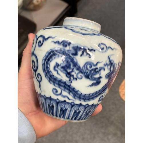 675 - A CHINESE BLUE AND WHITE 'DRAGON' JAR the tapering body underglaze blue painted with two dragons, be... 