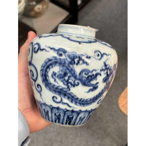 675 - A CHINESE BLUE AND WHITE 'DRAGON' JAR the tapering body underglaze blue painted with two dragons, be... 