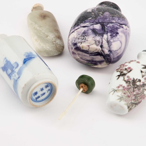 676 - FOUR CHINESE SNUFF BOTTLES including a blue and white figural cylindrical bottle. (4) Blue and white... 