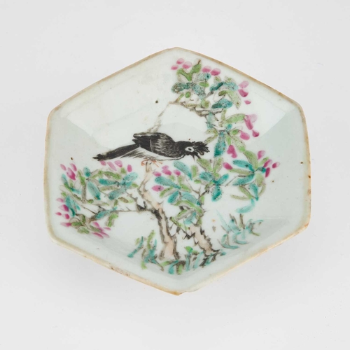 677 - A CHINESE FAMILLE ROSE HEXAGONAL DISH enamel painted with a bird perched on blossoming branches, rai... 