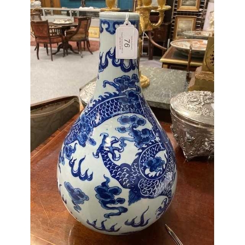 689 - A LARGE CHINESE BLUE AND WHITE DRAGON BOTTLE VASE, QING DYNASTY boldly painted in vivid cobalt blue ... 