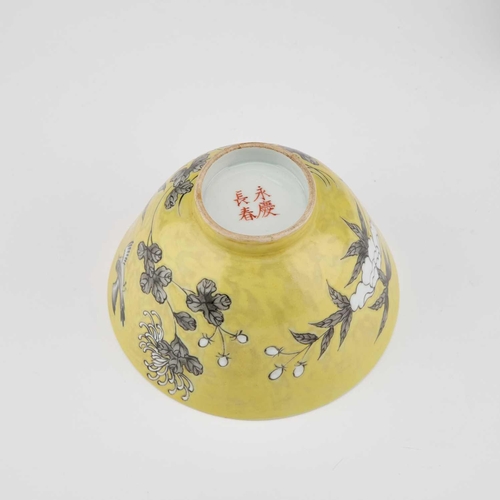 697 - A CHINESE YELLOW-GROUND BOWL AND A CHINESE GREEN-GLAZED VASE the bowl, decorated with birds and blos... 