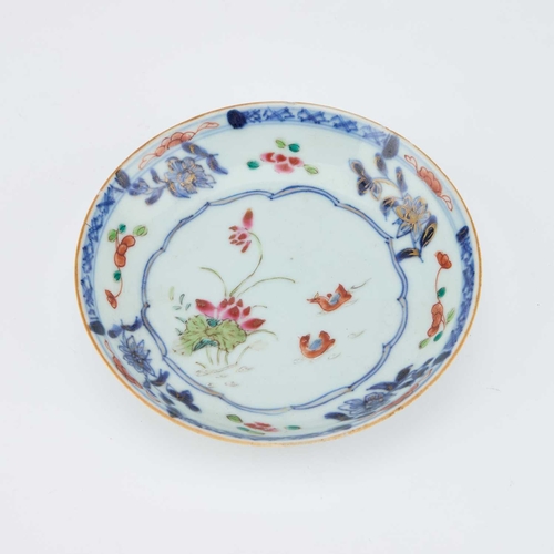 698 - V AN 18TH CENTURY CHINESE FAMILLE ROSE TEA BOWL AND SAUCER the tea bowl decorated with two reserves ... 