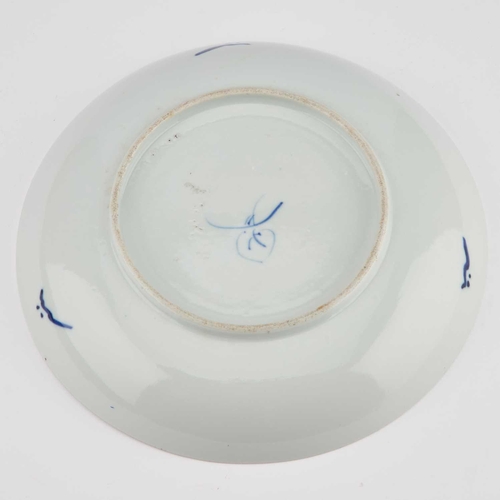 701 - A CHINESE BLUE AND WHITE DISH circular with raised sides, painted with foliage and inscribed. 24cm d... 