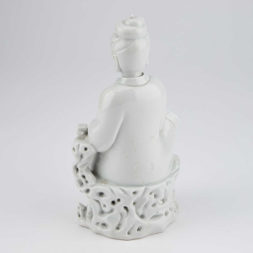 702 - A 19TH CENTURY CHINESE BLANC-DE-CHINE FIGURE OF GUANYIN impressed marks verso. 23cm high