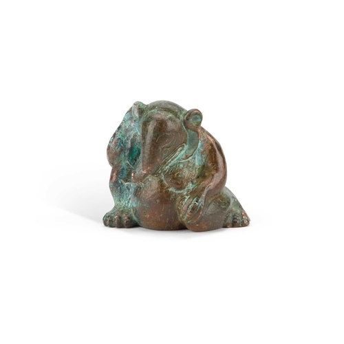 709 - A CHINESE BRONZE HAN-STYLE BEAR modelled sat with one knee raised. 5cm high