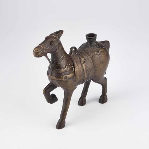 711 - AN INDIAN BRONZE MODEL OF A HORSE, 17TH/ 18TH CENTURY with engraved decoration. 19.5cm high