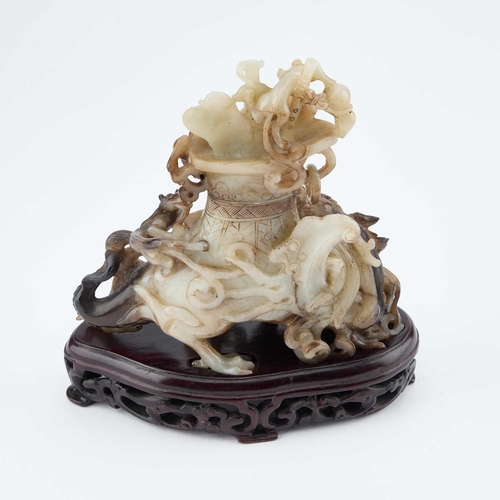 716 - A CHINESE BLACK AND WHITE JADE 'MYTHICAL BEAST' VASE AND COVER late Qing Dynasty/ Republic Period, t... 