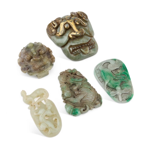 723 - A GROUP OF JADE comprising two buckles and three plaques. (5)Each is in good condition.... 