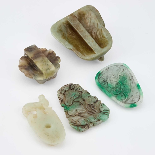 723 - A GROUP OF JADE comprising two buckles and three plaques. (5)Each is in good condition.... 