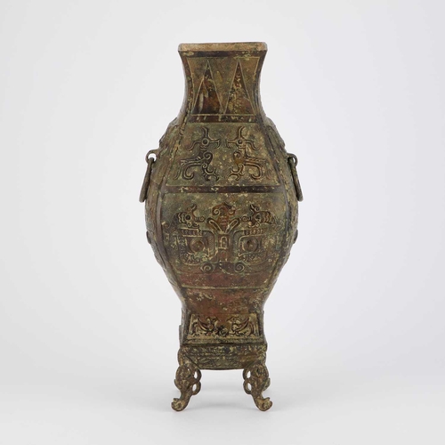 735 - A CHINESE BRONZE VASE in Archaistic style, on a stand. (2) 35.5cm high