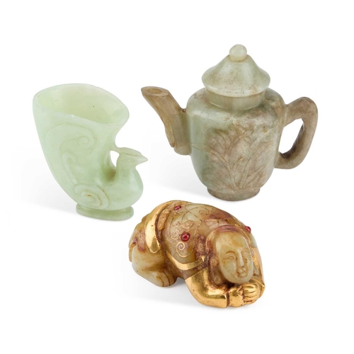 749 - THREE CHINESE JADE CARVINGS comprising a gilded and jewelled figure, a libation cup and a small ewer... 