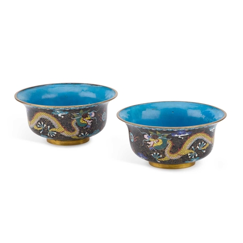 753 - A PAIR OF CHINESE CLOISONNÉ ENAMEL 'DRAGON' BOWLS circular with everted rims, each decorated with tw... 