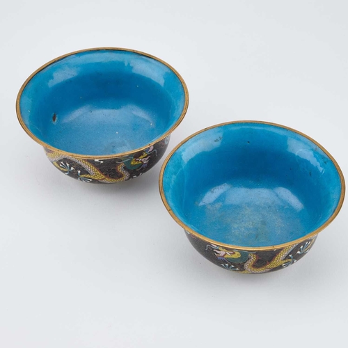 753 - A PAIR OF CHINESE CLOISONNÉ ENAMEL 'DRAGON' BOWLS circular with everted rims, each decorated with tw... 