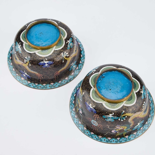 753 - A PAIR OF CHINESE CLOISONNÉ ENAMEL 'DRAGON' BOWLS circular with everted rims, each decorated with tw... 