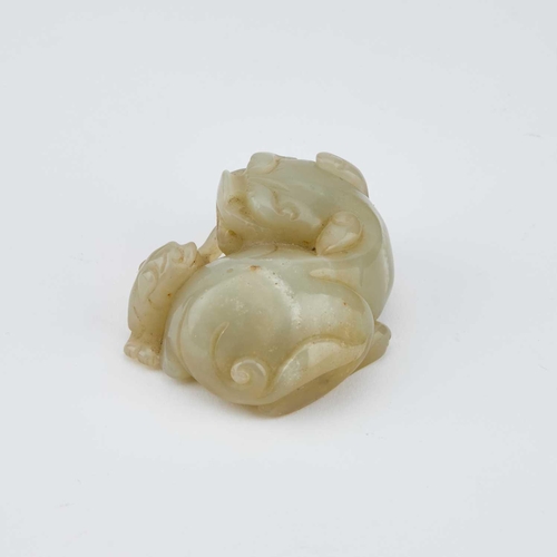 754 - A CHINESE JADE CARVING OF A BUDDHIST LION WITH CUB 7cm longIn generally good condition.... 