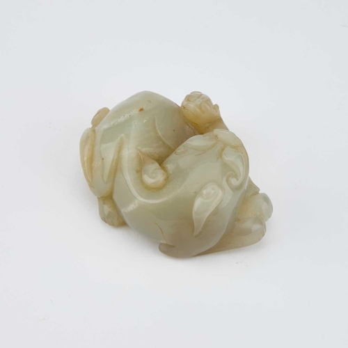 754 - A CHINESE JADE CARVING OF A BUDDHIST LION WITH CUB 7cm longIn generally good condition.... 