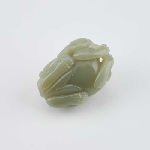 756 - A CHINESE JADE CARVING OF A BUDDHIST LION carved clutching a brocade ball. 5.5cm longIn generally go... 