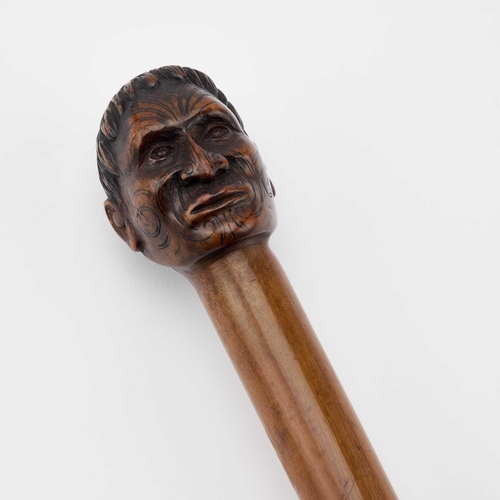 8 - A NEW ZEALAND WALKING CANE, LATE 19TH OR EARLY 20TH CENTURY the terminal finely carved as the tattoo... 