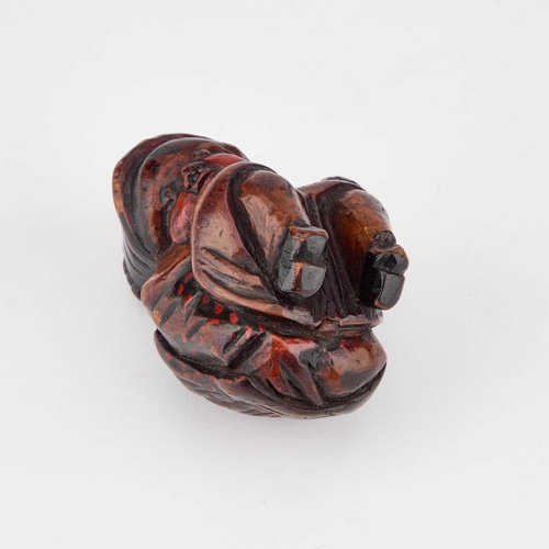 823 - A 19TH CENTURY PRIMITIVE FIGURAL SNUFF BOX naively carved as a squatting plump woman with rosy cheek... 