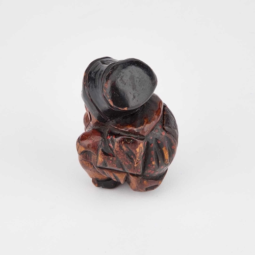 823 - A 19TH CENTURY PRIMITIVE FIGURAL SNUFF BOX naively carved as a squatting plump woman with rosy cheek... 