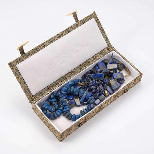 848 - THREE STRANDS OF LAPIZ LASULI BEADS strung in to three necklaces of graduating rough cut lapis and o... 