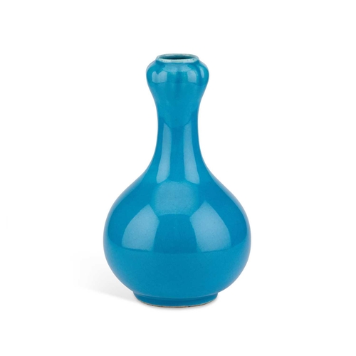 89 - A BLUE-GLAZED POTTERY VASE, CIRCA 1900 the globular body rising to a garlic-neck. 24cm high