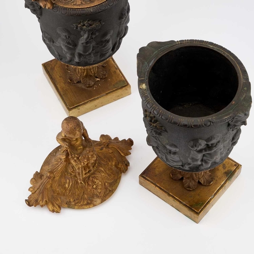 908 - A PAIR OF LATE 19TH CENTURY GILT AND PATINATED BRONZE URNS AND COVERS each leaf-cast cover surmounte... 