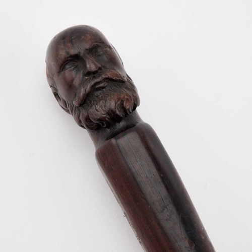 935 - A 19TH CENTURY CARVED HARDWOOD CANE the terminal carved as the head of a gentleman. 78.5cm long... 