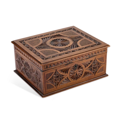 145 - A CARVED WOODEN BOX rectangular, the hinged cover and sides with carved decoration, the interior lin... 