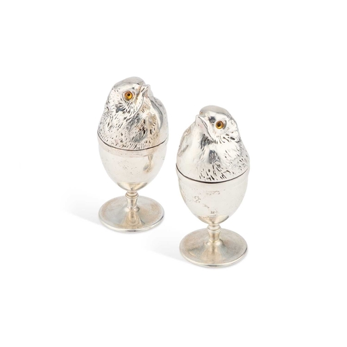 232 - A PAIR OF SILVER-PLATED NOVELTY EGG CUPS each egg cup of usual form with a removable chick-shaped co... 