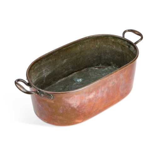 54 - A 19TH CENTURY COPPER FISH KETTLE of oval form, with a rolled top edge and two brass carrying handle... 